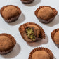 Product spread with broken truffle showing pistachio