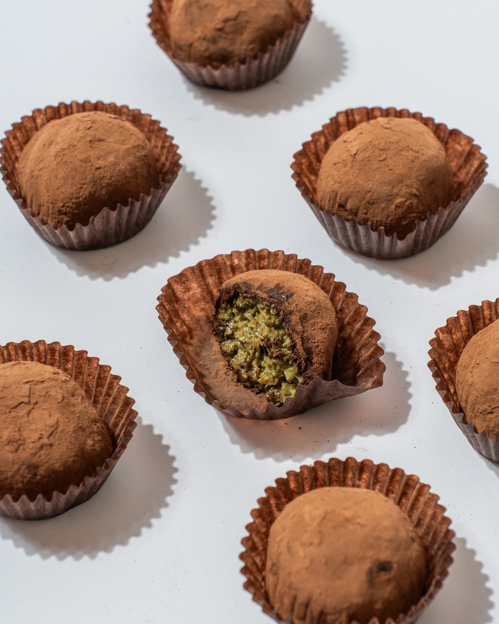 Product spread with broken truffle showing pistachio