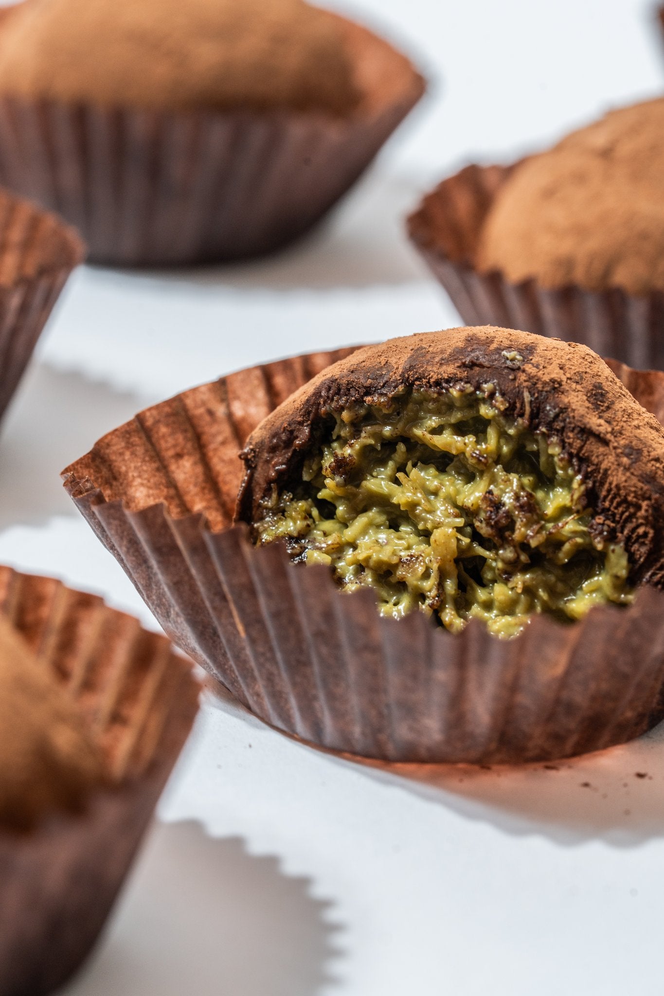 Close-up of broken truffle with pistachio filling